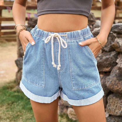 Glow Chic's Tied Curling Denim Shorts with trendy design and comfortable fit.