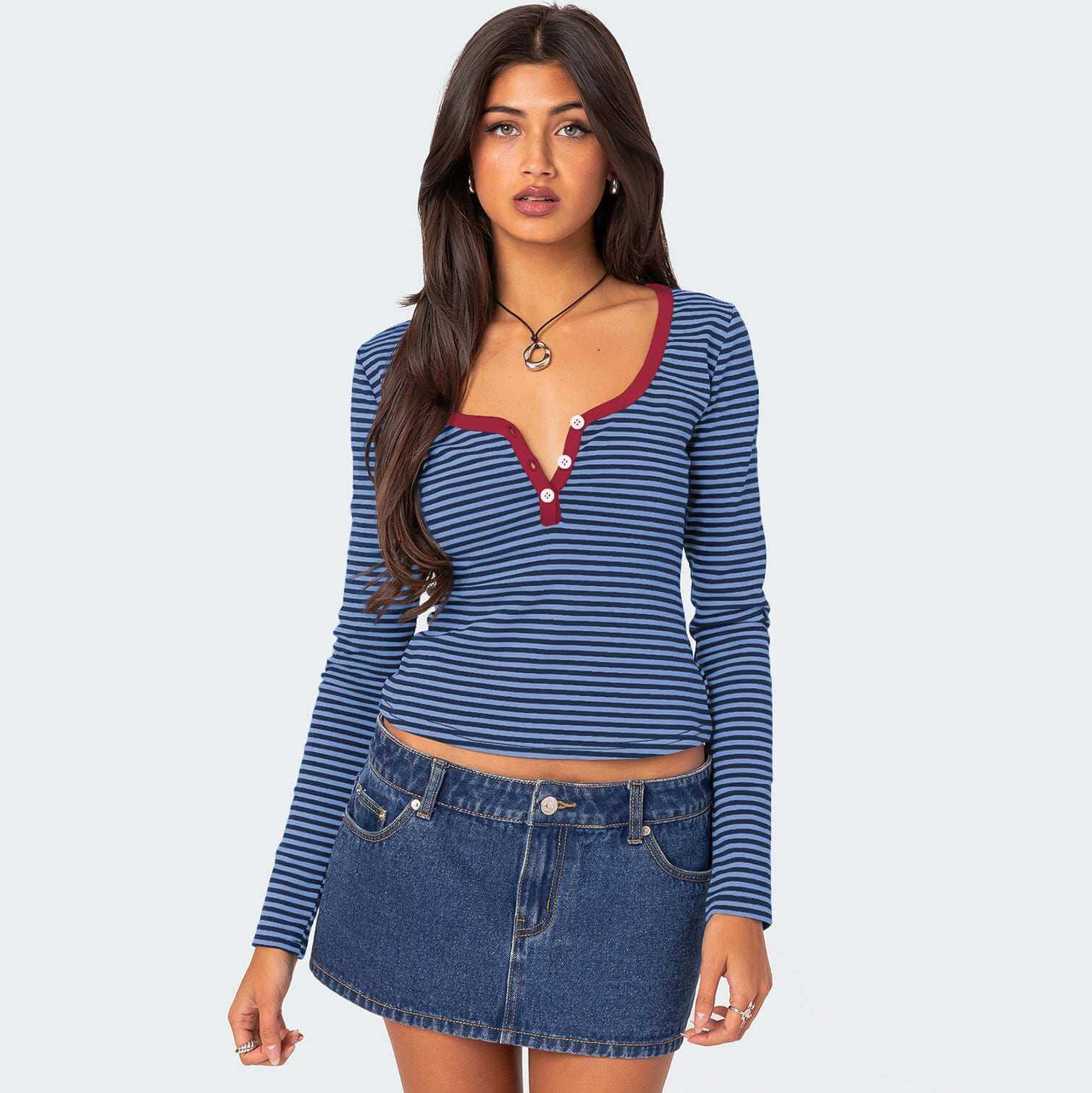 Contrast color striped sweater with playful design, made of cotton for comfort and style.