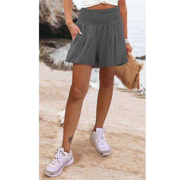 Woman wearing Glow Chic's High Waist Shorts made of spandex and chenille, perfect for casual outings.