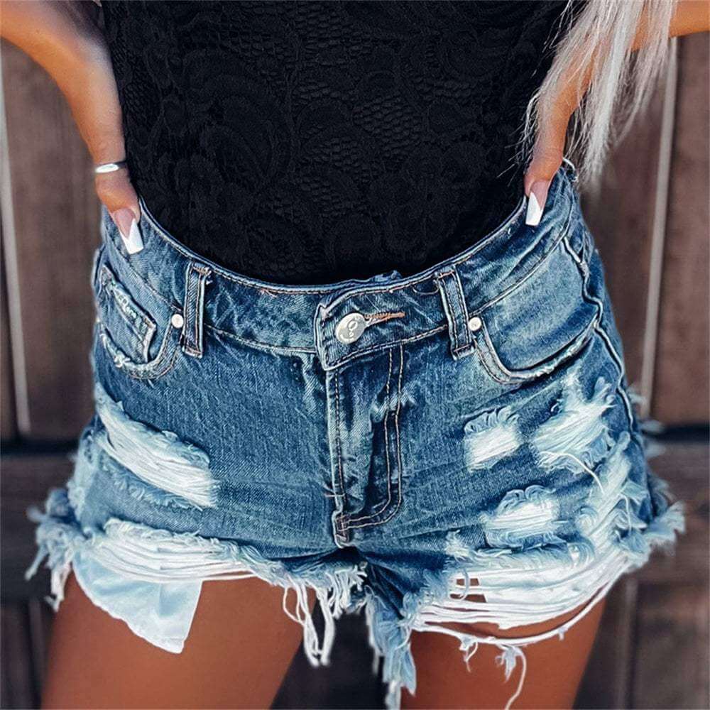 Ripped tassel denim shorts with bold and playful design, ideal for summer and festivals.