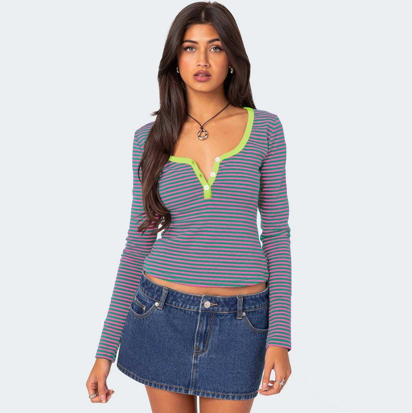 Glow Chic's contrast color striped sweater on model, showcasing playful style and comfortable fit.